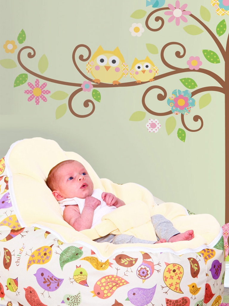 Baby Sitting in a Chibebe Chirpy Style Baby Bean Bag with Cream Baby Seat